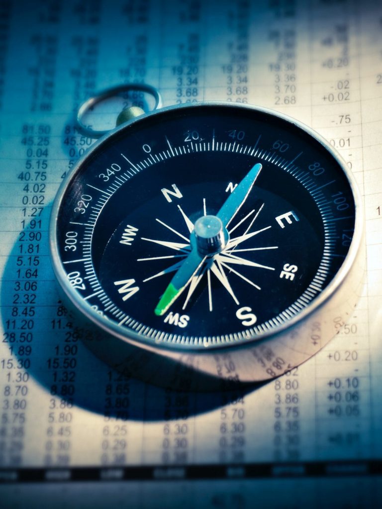 the compass representing a plan for financial and debt relief
